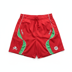 BROKEN PLANET SKULL GRAPHIC WIND SHORTS RED GREEN white background flat lay