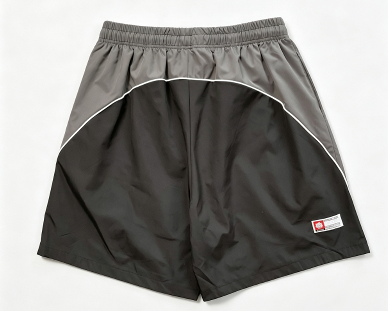 BROKEN PLANET GRAFFITI COLOR‑BLOCK NYLON SHORTS BLACK GREY
