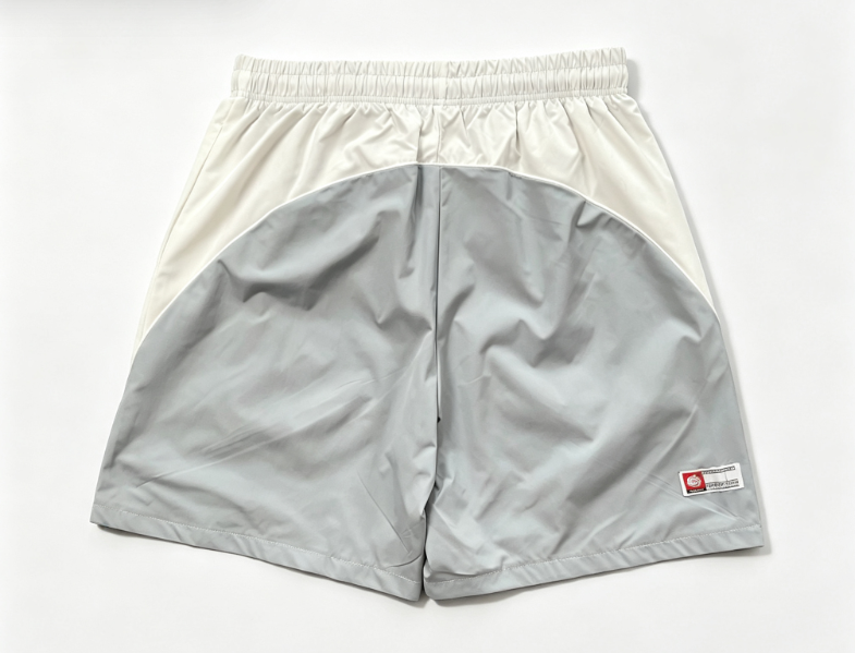 BROKEN PLANET GRAFFITI COLOR‑BLOCK NYLON SHORTS LIGHT GREY WHITE