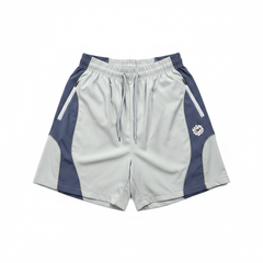BROKEN PLANET COLOR BLOCK WIND SHORTS LIGHT BLUE NAVY - white background flat lay